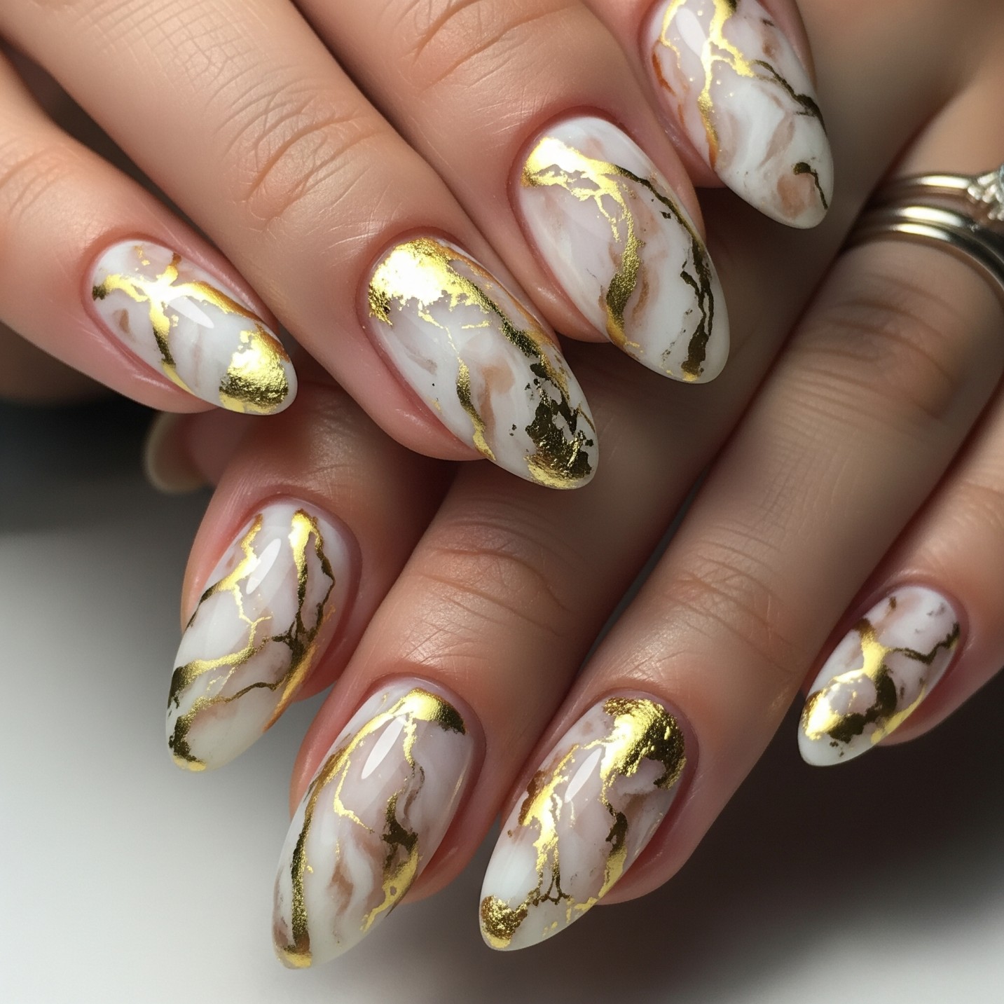 Marble Nail Art with Gold Accents ​​