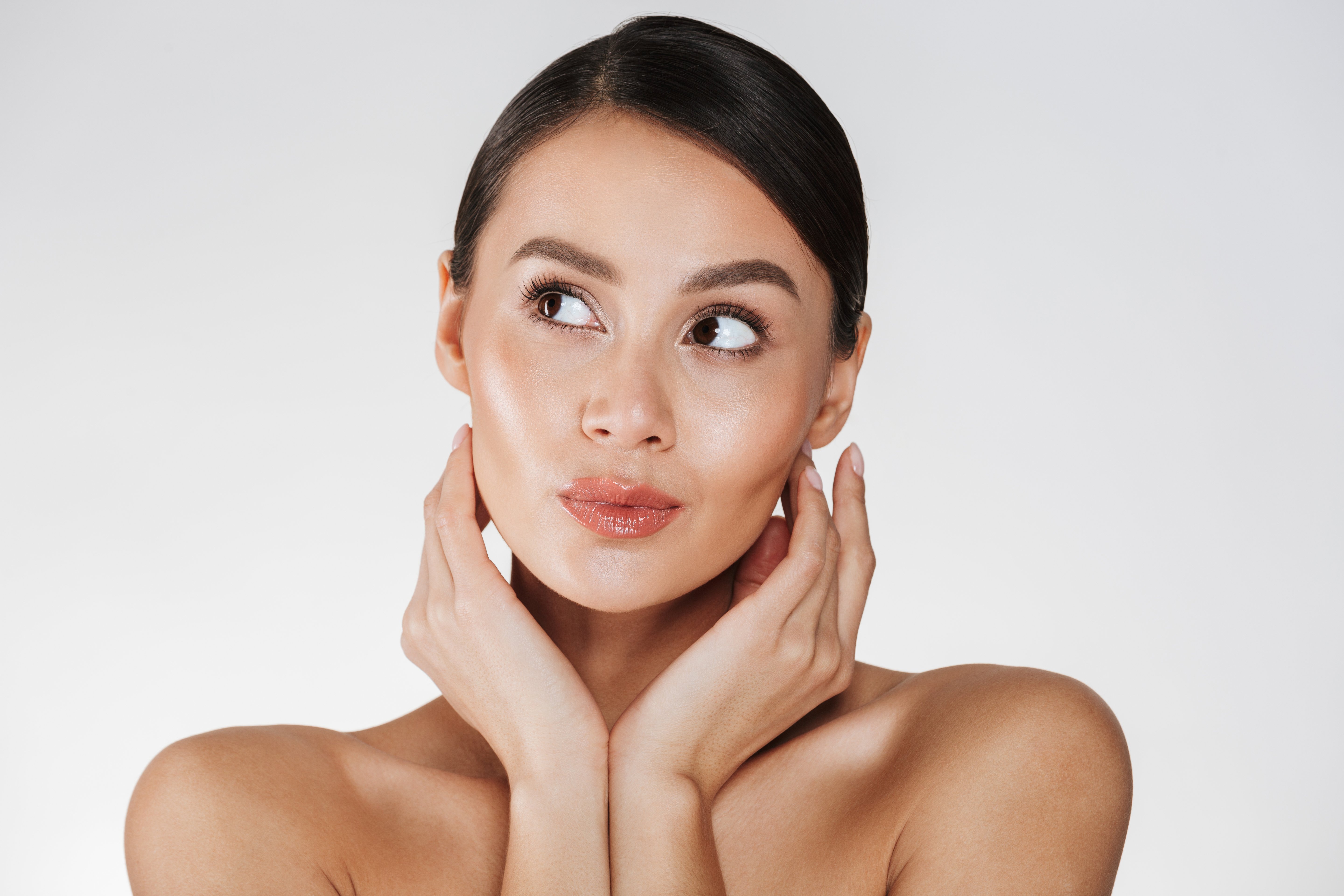 close-up-portrait-beautiful-woman-with-natural-makeup-looking-aside-holding-hands-close-her-healthy-face-isolated-white