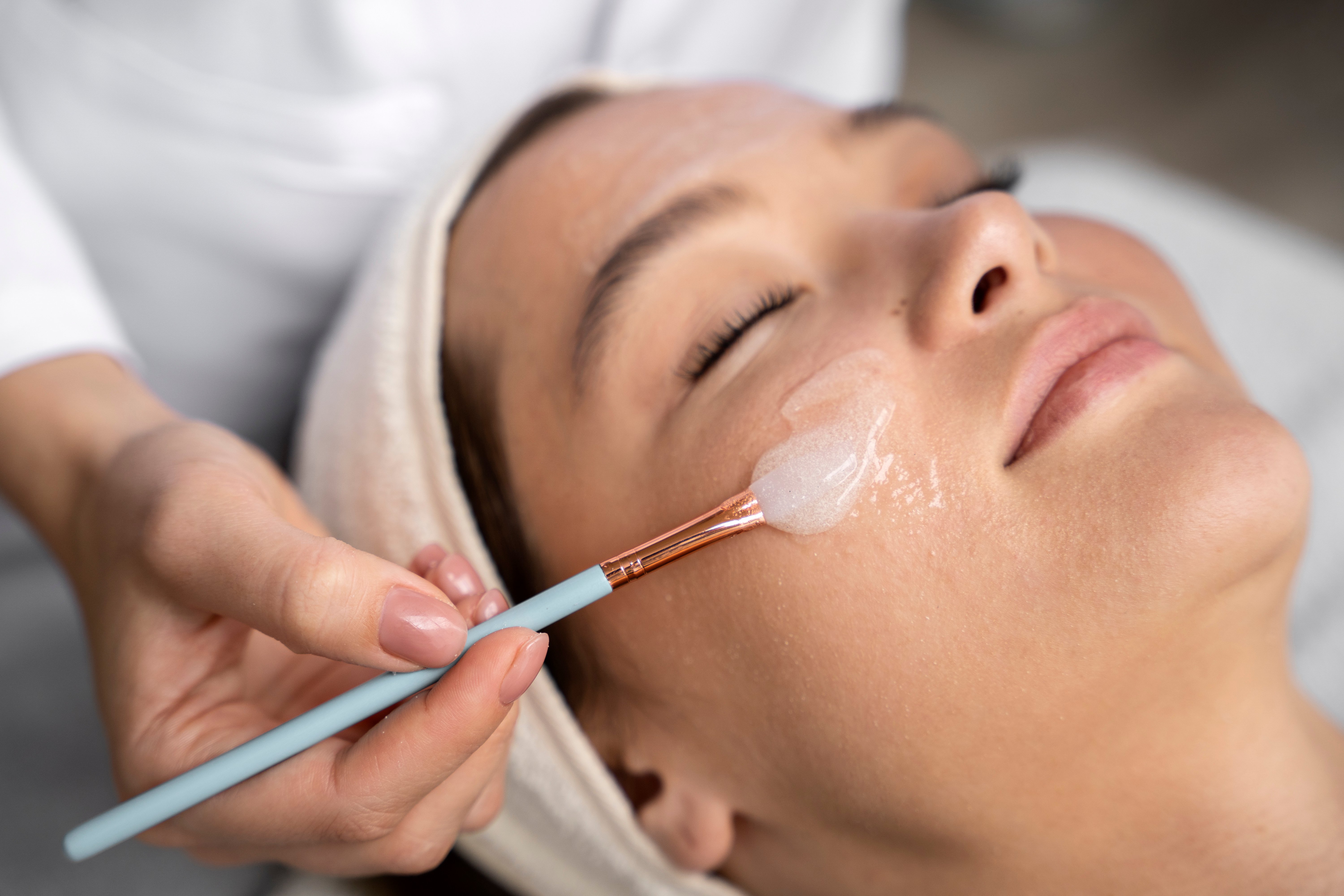 high-angle-woman-getting-massaged-spa