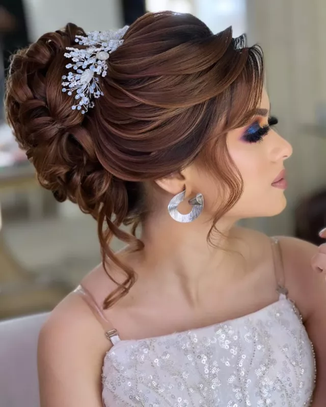 Side-parted bun with Crown Embellishment Wedding Hairstyle for Saree