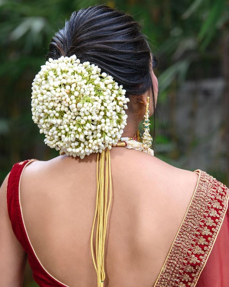 Sleek Low Bun with White Makri Gajra Wedding Hairstyle for Saree