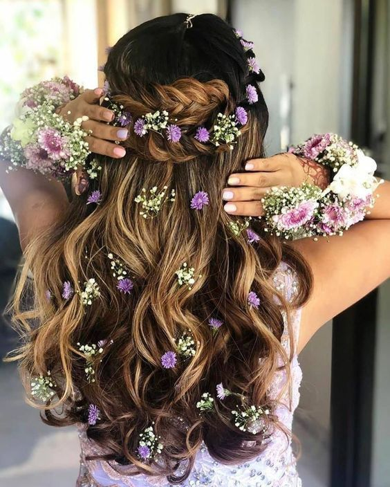 Twisted Half-Updo with Floral Hair Clip Wedding Hairstyle for Saree