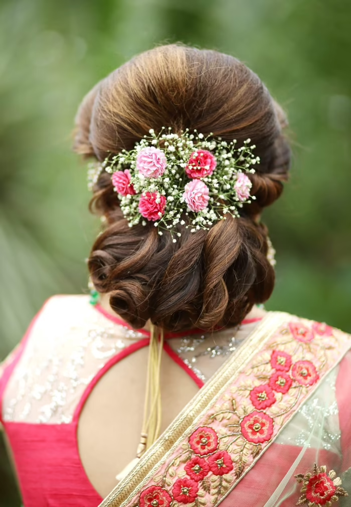  Low Bun with Hair Clip Wedding Hairstyle for Saree