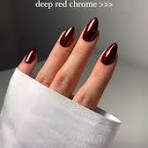 Red chrome nails with a metallic sheen