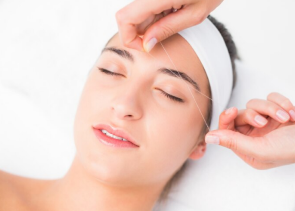 Threading upper lip hair 